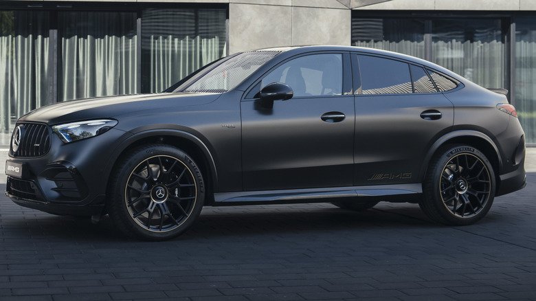 2027 Mercedes-AMG GLC53 Returns Six-Cylinder Power to Compact Performance SUV Lineup 5 A side view of a matte black AMG GLC53 with the Golden Accents Package showing the gold on the wheels and the subtle AMG badge on the rear doors
