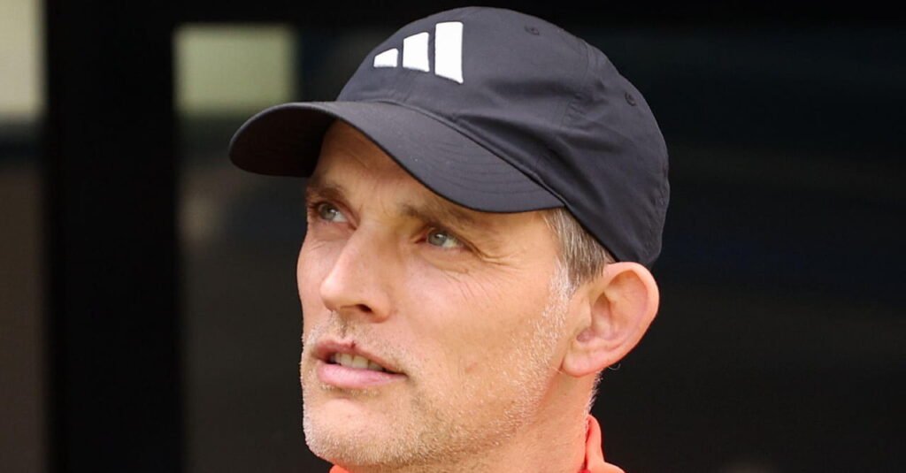 Tuchel Defends Tactical Shift as England Grapple With Late World Cup Collapse 2 Football manager Thomas Tuchel looking upwards to his right in an outdoor setting with his mouth open while wearing a dark baseball cap with a white Adidas logo on the front