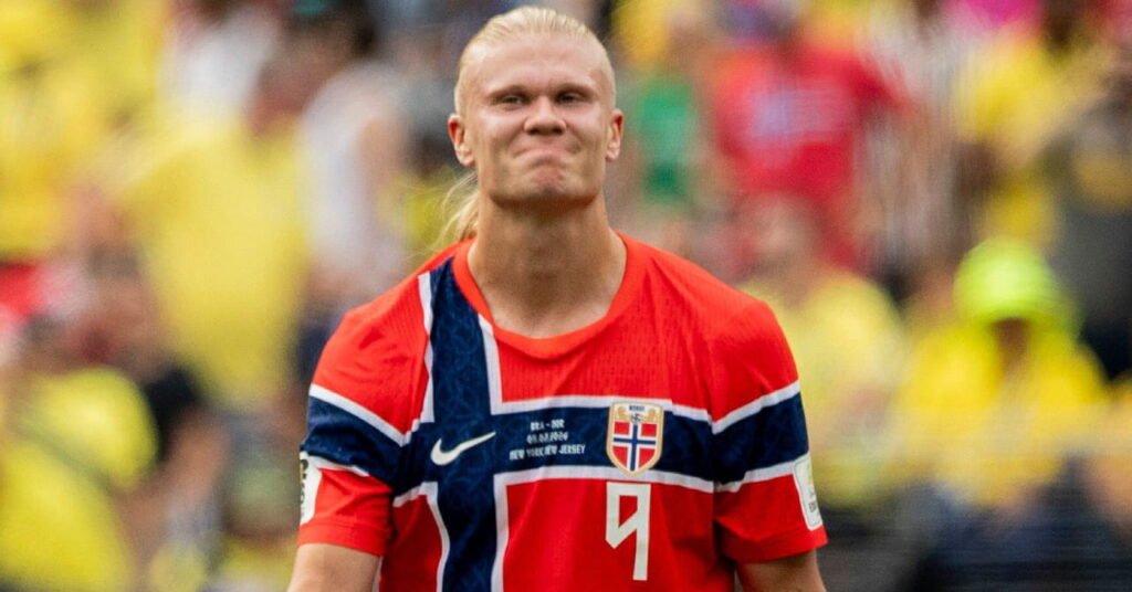 2026 World Cup: Messi Solidifies Legacy as European Stars Falter in North America 3 Footballer Erling Haaland smiling on a pitch during the World Cup 2026 while wearing the Norway national team football kit of a red shirt with blue and white cross and his number in white on the shirt with a crowd blurrily visible in the background