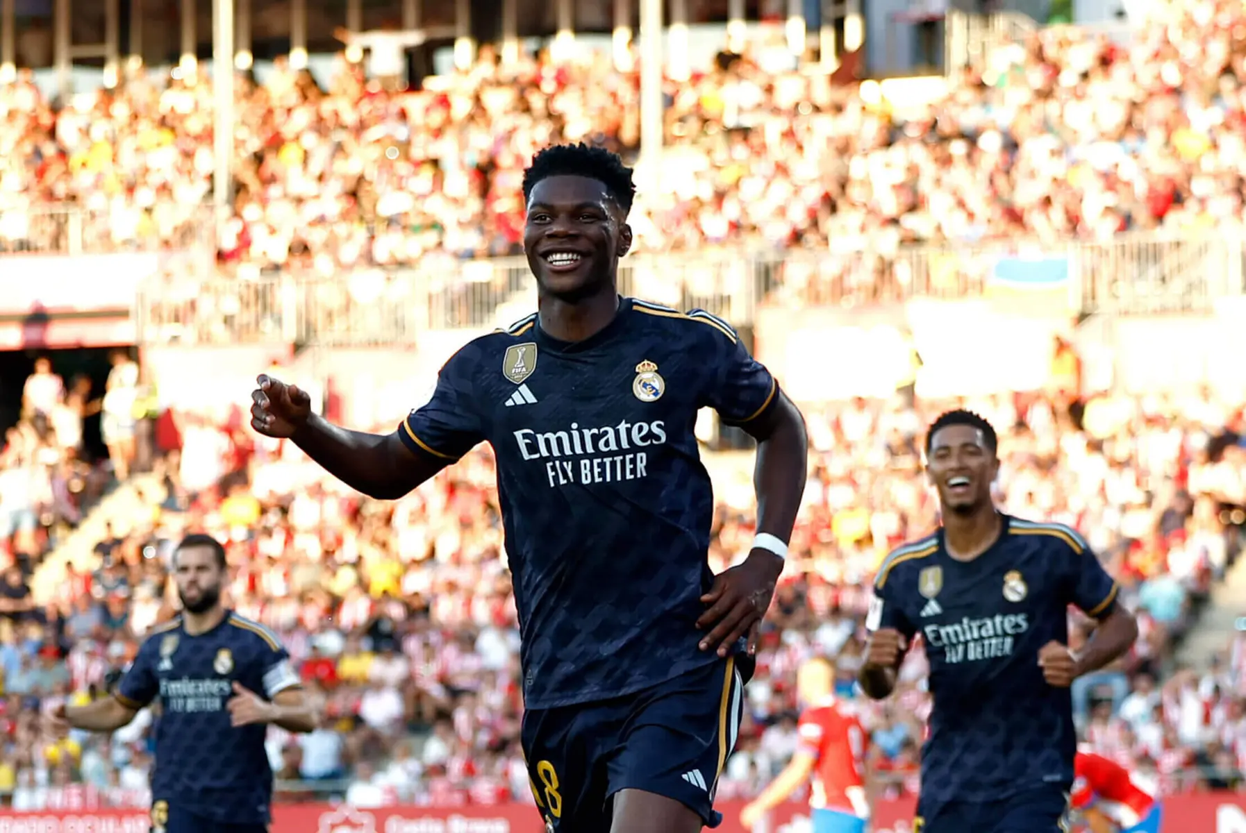 Real Madrid Near Agreement with Vinícius Júnior on Lucrative 2030 Contract Extension 2 Aurelien Tchouameni smiling in a dark blue Real Madrid kit during a football match