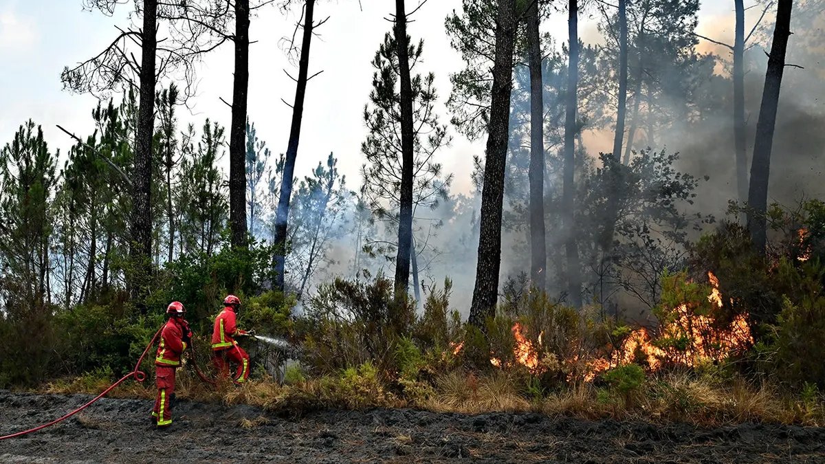 Southwestern Europe Fire Crisis Forces Mass Evacuations Across France and Spain 2 Firefighters battle a wildfire near Marcheprime, outside Bordeaux, France.