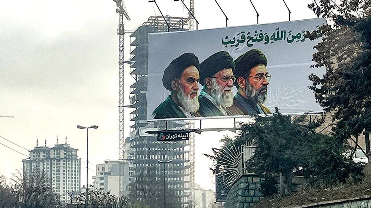 US Service Member Killed in Iraq Drone Ordnance Disposal as Search Continues in Jordan 3 Billboard shows Iran's three supreme leaders.