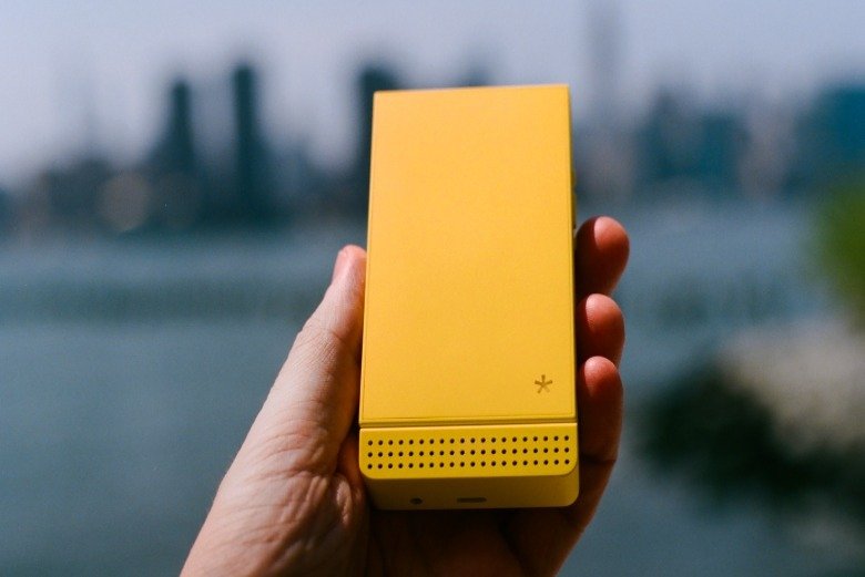 A yellow Light Flip phone.