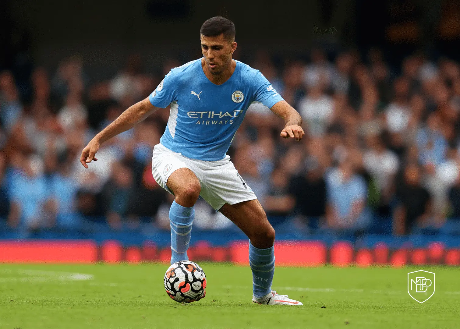 Real Madrid Rebuff Rodri Transfer Reports in Direct Communication with Manchester City 2 Manchester City midfielder Rodri controlling a soccer ball on the pitch during a match