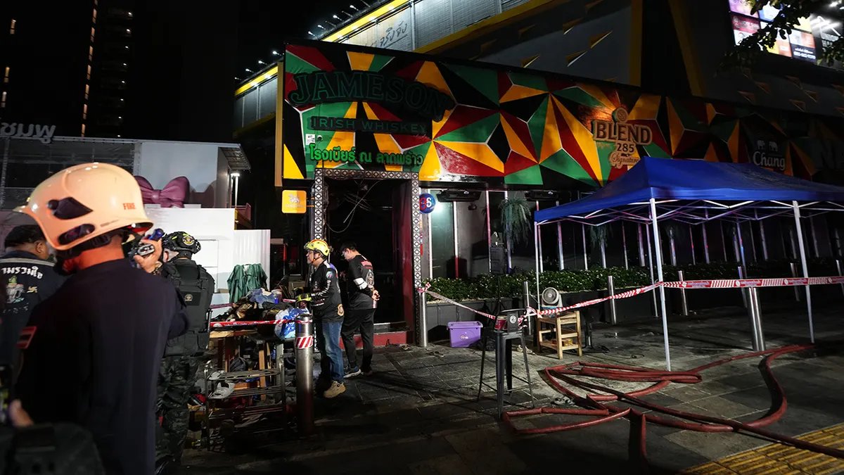 At Least 27 Dead, Dozens Injured in Devastating Bangkok Pub Fire 3 Rescuers work at the site of a fire in Bangkok