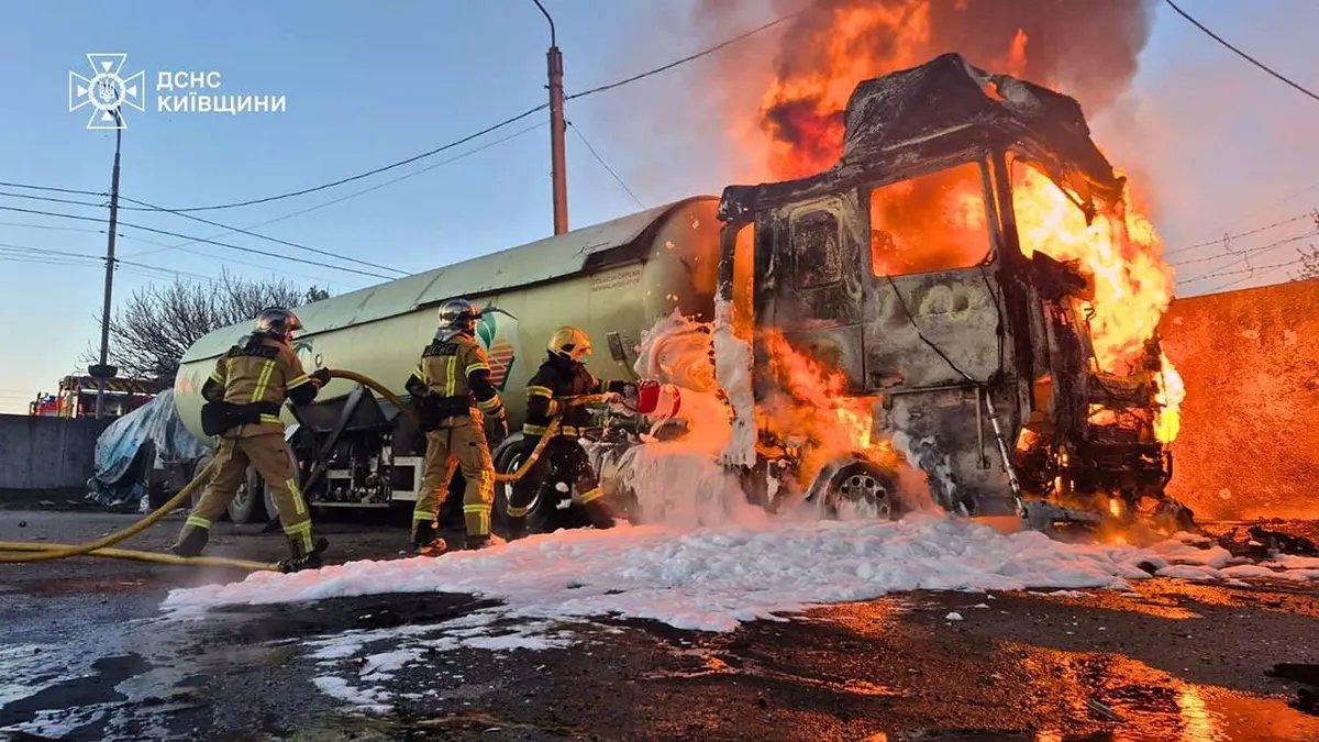 Trump Signals Putin Ready for Peace Deal as Russia Threatens Western Troops 4 Emergency services personnel extinguishing fire on vehicle in Kyiv region