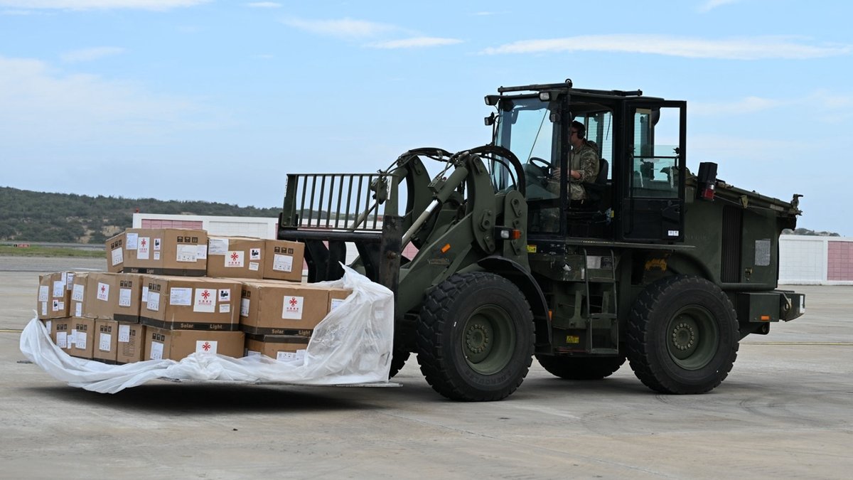 U.S. Troops Unload Chinese Aid Flight in Earthquake-Stricken Venezuela 3 U.S soldier drives a wheel loader