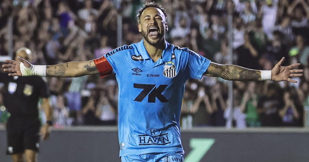 Brazil footballer Neymar celebrating a goal with outstretched arms while on a pitch playing for Santos Football Club in a blue kit