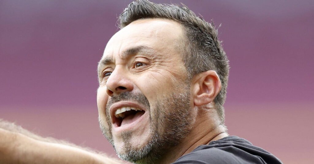Arsenal Favored to Retain Premier League Title as Rivals Face Managerial Overhauls 2 Football manager Roberto De Zerbi raising his right arm and voicing instructions while serving as head coach of Premier League team Tottenham Hotspur Football Club