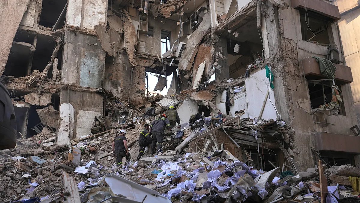 Triple-Digit Food Inflation and Currency Collapse Drive Iran's Household Crisis 4 Lebanese civil defense workers search through the concrete rubble and twisted metal of a destroyed building.