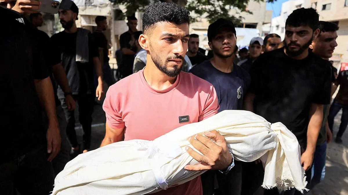U.S.-Backed Gaza Peace Roadmap Faces Instant Rejection from Israel and Hamas 4 A mourner carries the body of a Palestinian who was killed in Israeli strikes, according to medics, during a funeral, in Gaza City