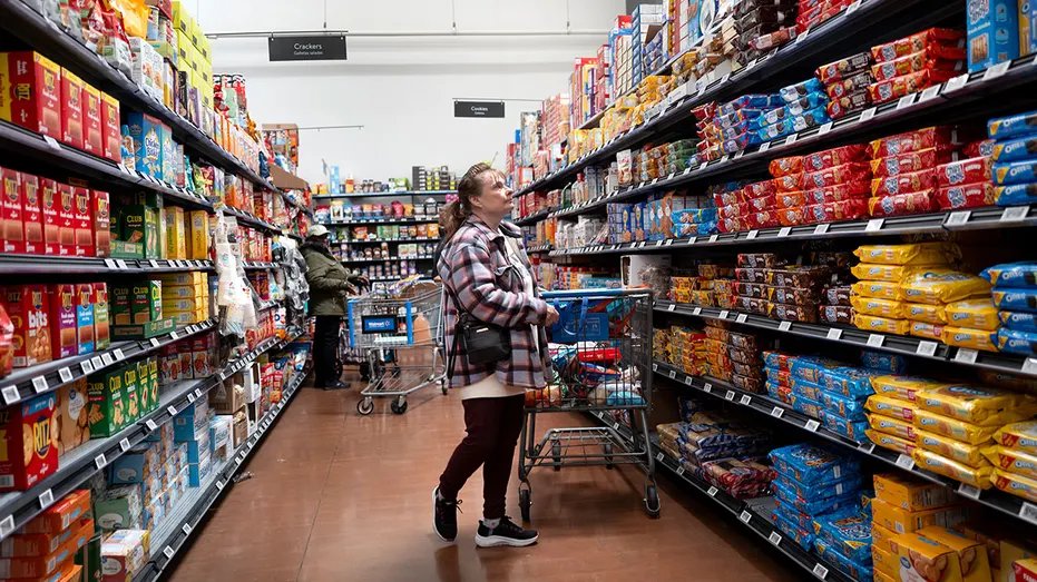 Shopper looks at cookies in Walmart store