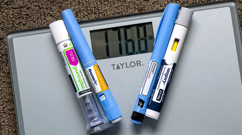 GLP-1 Surge Rewires Healthcare Economy as Bariatric Surgeries Drop 34% 3 photo illustration of weight loss injection pens on a weight scale showing 176 pounds