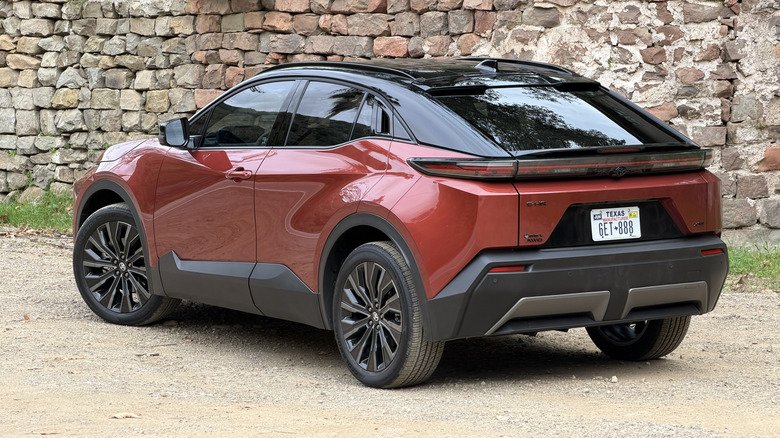 Rear 3/4 view of an orange 2026 Toyota C-HR