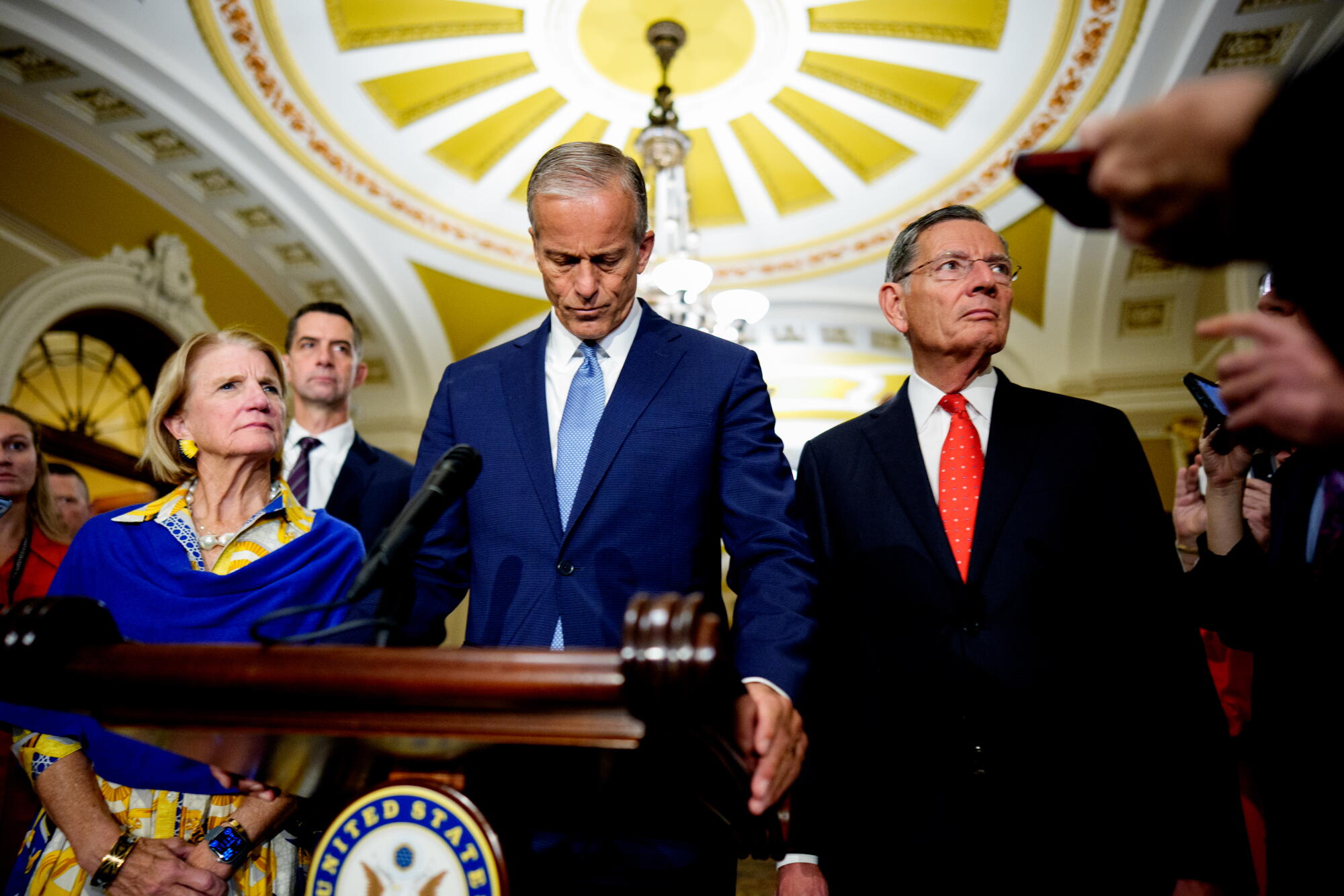 Senate Majority Leader John Thune and others answer questions from reporters at the Capitol.