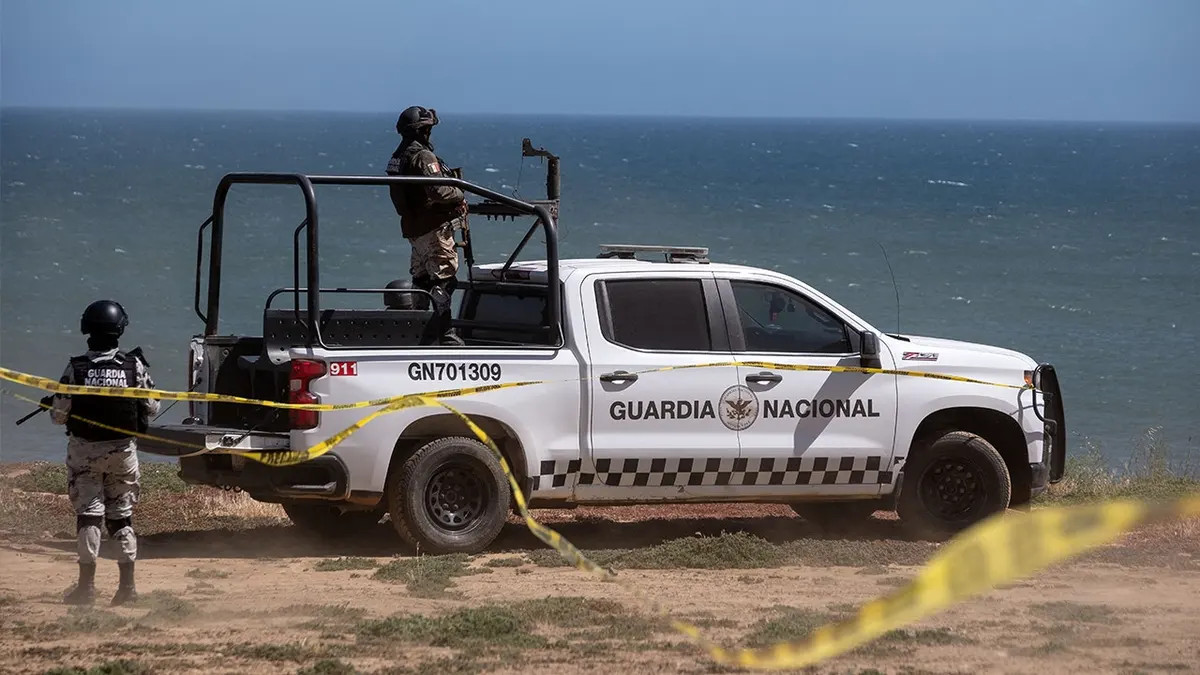 National Guard vehicles guard a state prosecutors investigative search at the site where three surfers were camping before disappearing during a surf trip, as the investigation continues in El Faro, Santo Tomas delegation in Ensenada, Baja California state, Mexico, on May 6, 2024. Baja California State Prosecution Office confirmed the deaths of Australian brothers Jake and Callum Robinson and their American friend Jack Carte on May 5, 2024.