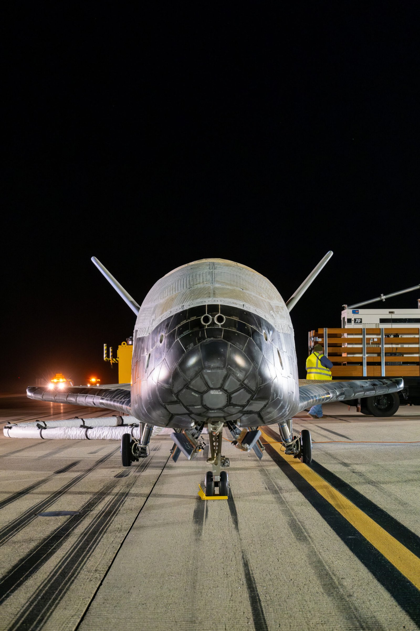 The U.S. Space Force X-37B spaceplane on a runway after landing at Vandenberg Space Force Base on March 7, 2025
