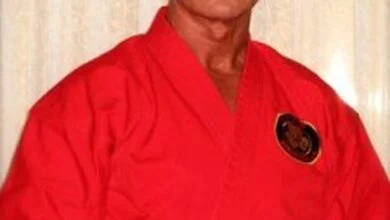 Richard Norton in 2014, wearing a red martial arts gi