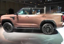 2026 Mitsubishi Pajero in Armor Copper at its Tokyo reveal event, left side view