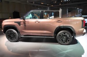 2026 Mitsubishi Pajero in Armor Copper at its Tokyo reveal event, left side view