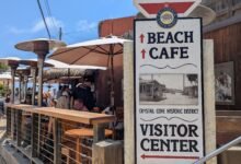 Crystal Cove Historic District sign and the Beachcomber cafe deck, Crystal Cove State Park, photographed 25 May 2025