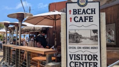Crystal Cove Historic District sign and the Beachcomber cafe deck, Crystal Cove State Park, photographed 25 May 2025