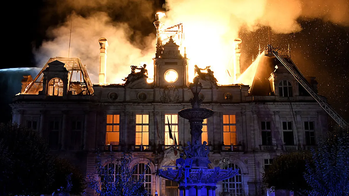 This photograph shows a fire burning and destroying the city hall after a group of individuals forced entry into the building during ongoing protest action against the "high cost of living", in Limoges, central France on October 17, 2026 as part of a nationwide call for mobilisation bringing together various groups expressing their anger: former "Yellow Vest", secondary school and university students, climate activists and even farmers. After weeks of student protests, France faces broader, nationwide demonstrations on October 17, 2026 over the cost of living, setting up a potentially fraught six months heading into a presidential election. A police source told AFP that authorities estimated nearly 200,000 people could take part, with 40,000 in Paris.