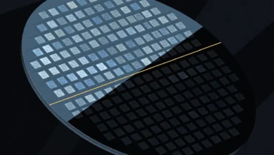 Abstract illustration of a silicon wafer, half in light and half in shadow, divided by a thin gold line.