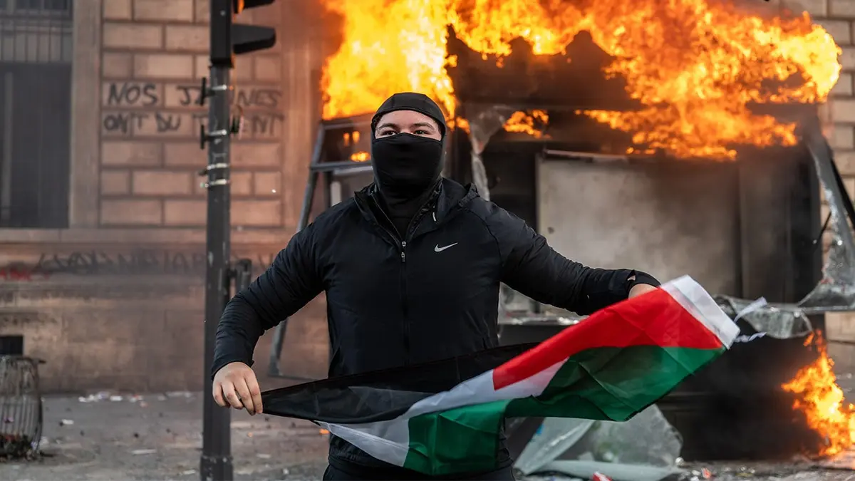 French School Protestor holding Palestinian flag