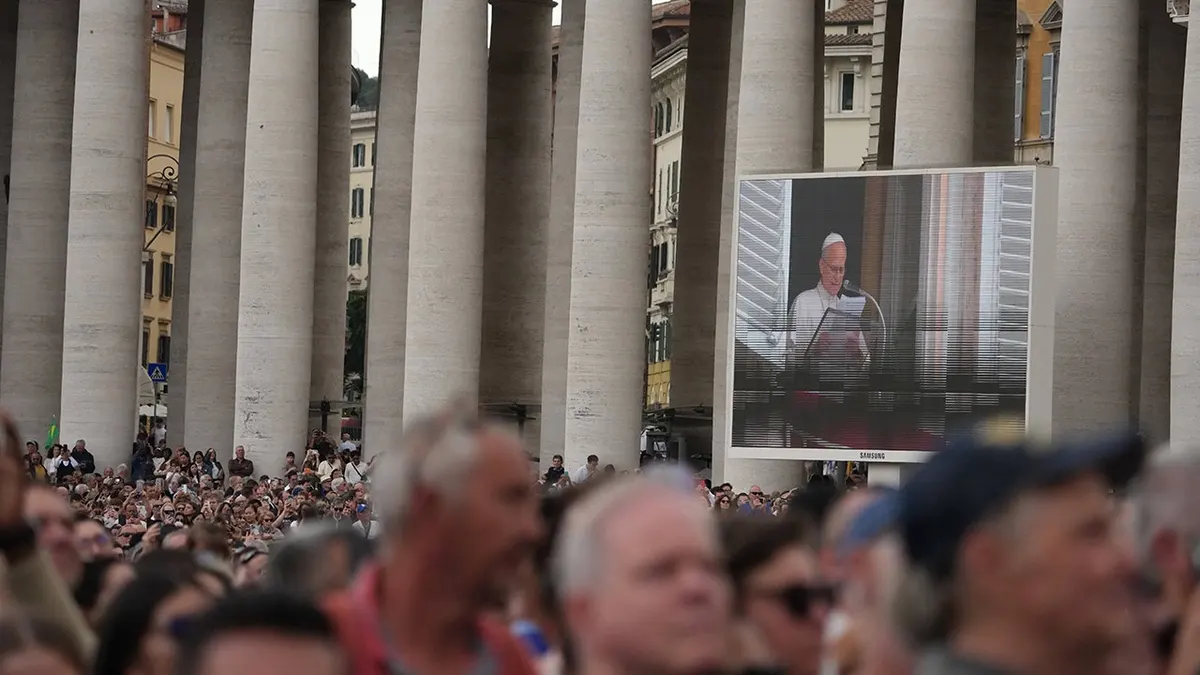Pope Leo XIV appears at a window of the Apostolic Palace overlooking St. Peter's Square.