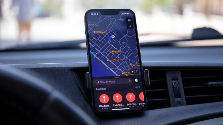 Apple Maps, running on an iPhone propped up in a car's vent mount.